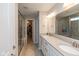 Luxurious main bathroom with double vanity, a glass-enclosed shower and walk-in closet at 4642 Boyd Pl, Westfield, IN 46062
