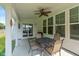 Covered patio featuring a four-chair table set, ceiling fan, and sliding glass doors at 4642 Boyd Pl, Westfield, IN 46062