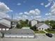 Community with pool and garages as seen from an upper-level parking lot at 5019 Amber Creek Pl, Indianapolis, IN 46237