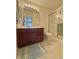 Bathroom with a sink, a toilet and a shower with a sliding glass door at 5019 Amber Creek Pl, Indianapolis, IN 46237