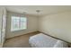 Well-lit bedroom with ample natural light from a large window, perfect for a restful retreat at 5019 Amber Creek Pl, Indianapolis, IN 46237