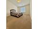 Bedroom with carpeted floors, a bed, and a window with blinds at 5019 Amber Creek Pl, Indianapolis, IN 46237