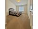 Carpeted bedroom features neutral walls, window with blinds, and a bed frame at 5019 Amber Creek Pl, Indianapolis, IN 46237