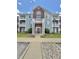Charming condo building with brick and siding, featuring a well-maintained lawn and convenient parking at 5019 Amber Creek Pl, Indianapolis, IN 46237