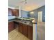 Well-appointed kitchen with a breakfast bar overlooking the dining area, complemented by stylish blue walls at 5019 Amber Creek Pl, Indianapolis, IN 46237