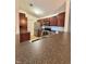 Well-lit kitchen features stainless steel appliances, dark cabinetry, and a countertop with a sink at 5019 Amber Creek Pl, Indianapolis, IN 46237
