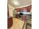Efficient kitchen layout with stainless steel appliances and abundant cabinet storage at 5019 Amber Creek Pl, Indianapolis, IN 46237