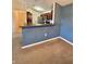 View of the kitchen with stainless steel appliances and dark cabinets from the living area at 5019 Amber Creek Pl, Indianapolis, IN 46237