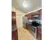 Modern kitchen featuring stainless steel appliances and ample counter space for meal preparation at 5019 Amber Creek Pl, Indianapolis, IN 46237