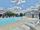 Community pool surrounded by lounge chairs and well-maintained landscaping at 5019 Amber Creek Pl, Indianapolis, IN 46237