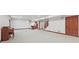 Basement featuring neutral carpeting with views of the bar, stairs, and entry to other rooms at 5274 Brooks Bnd, Greenwood, IN 46143
