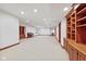 Spacious finished basement with recessed lighting and built-in shelving offers great potential at 5274 Brooks Bnd, Greenwood, IN 46143