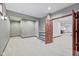Basement rec room features a door to an additional room and stylish paint and trim at 5274 Brooks Bnd, Greenwood, IN 46143
