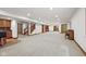 Large finished basement with bar area, staircase, and open space for recreation and entertaining at 5274 Brooks Bnd, Greenwood, IN 46143