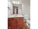 Bathroom with a single sink vanity, toilet, and large mirror at 5274 Brooks Bnd, Greenwood, IN 46143