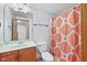 Bathroom featuring a vanity with a decorative mirror, with shower behind an orange patterned curtain at 5274 Brooks Bnd, Greenwood, IN 46143