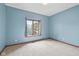 Bedroom with neutral carpet, light blue walls and a large window for natural light at 5274 Brooks Bnd, Greenwood, IN 46143