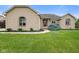 Charming brick home featuring arched windows and professionally landscaped front yard at 5274 Brooks Bnd, Greenwood, IN 46143