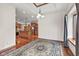 Bright living room featuring hardwood floors, windows with a view and a decorative rug at 5274 Brooks Bnd, Greenwood, IN 46143