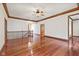 Spacious living room with hardwood flooring, a staircase, and natural light at 5274 Brooks Bnd, Greenwood, IN 46143