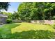Large, well-maintained backyard with lush lawn and established perimeter plantings at 54 Horseshoe Ln, Carmel, IN 46033