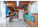 Unfinished basement includes pegboard, storage shelving, and work space at 54 Horseshoe Ln, Carmel, IN 46033