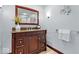 Bathroom featuring dark wood vanity, granite countertops, and chrome fixtures at 54 Horseshoe Ln, Carmel, IN 46033