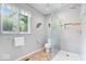 Bright bathroom features a glass shower, neutral tiling, and decor at 54 Horseshoe Ln, Carmel, IN 46033