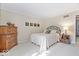 Cozy bedroom with neutral walls, carpet, and decorative details throughout the space at 54 Horseshoe Ln, Carmel, IN 46033