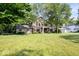 Spacious two-story home nestled on a large lot with a well-maintained lawn at 54 Horseshoe Ln, Carmel, IN 46033