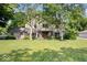 Charming two-story home with brick accents, large front yard, and mature trees at 54 Horseshoe Ln, Carmel, IN 46033