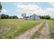 Picture of a white barn and shed and a big yard at 5707 In-234, McCordsville, IN 46055