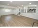 Finished basement with hardwood floors, recessed lighting, and open access to the upstairs at 5707 In-234, McCordsville, IN 46055