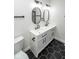 Bathroom featuring a dual sink vanity with black fixtures and a hexagonal tiled floor at 5707 In-234, McCordsville, IN 46055