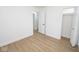 Well lit bedroom with neutral walls and wood flooring, features multiple closets at 5707 In-234, McCordsville, IN 46055