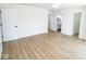 Bright bedroom with hardwood floors and three doors leading to other rooms at 5707 In-234, McCordsville, IN 46055