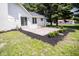 Back patio featuring landscaping and a porch swing with room for entertaining at 5707 In-234, McCordsville, IN 46055