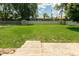 Backyard with grass, and a white fence at 5927 Meadowood Dr, Speedway, IN 46224