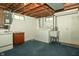 Basement laundry area with washer, dryer, utility sink and exposed pipes at 5927 Meadowood Dr, Speedway, IN 46224