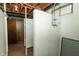 Partially finished basement with painted walls, carpet, a shower room and wood paneled walls at 5927 Meadowood Dr, Speedway, IN 46224