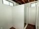 Finished basement with painted walls, carpet, and a finished shower room with windows at 5927 Meadowood Dr, Speedway, IN 46224