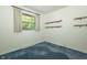 Bedroom featuring natural light from the window, neutral paint and blue carpet at 5927 Meadowood Dr, Speedway, IN 46224