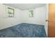 Bedroom featuring natural light, and blue carpet at 5927 Meadowood Dr, Speedway, IN 46224
