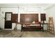 Spacious garage with workbench, pegboard, ladder, and access door to interior at 5927 Meadowood Dr, Speedway, IN 46224
