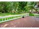 Relaxing deck overlooking a well-manicured backyard with mature trees at 6118 Deerwood Dr, Greenwood, IN 46143