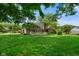 Expansive backyard featuring a large, well-maintained lawn and a charming screened-in porch at 6118 Deerwood Dr, Greenwood, IN 46143
