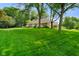 Large backyard with lush greenery, mature trees and a large lot at 6118 Deerwood Dr, Greenwood, IN 46143
