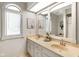Bright bathroom featuring double sinks, light countertops, and a large mirror at 6118 Deerwood Dr, Greenwood, IN 46143