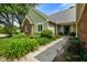 Inviting front entrance with beautiful landscaping and a walkway at 6118 Deerwood Dr, Greenwood, IN 46143
