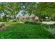 Charming home with a well-maintained lawn and lush landscaping at 6118 Deerwood Dr, Greenwood, IN 46143